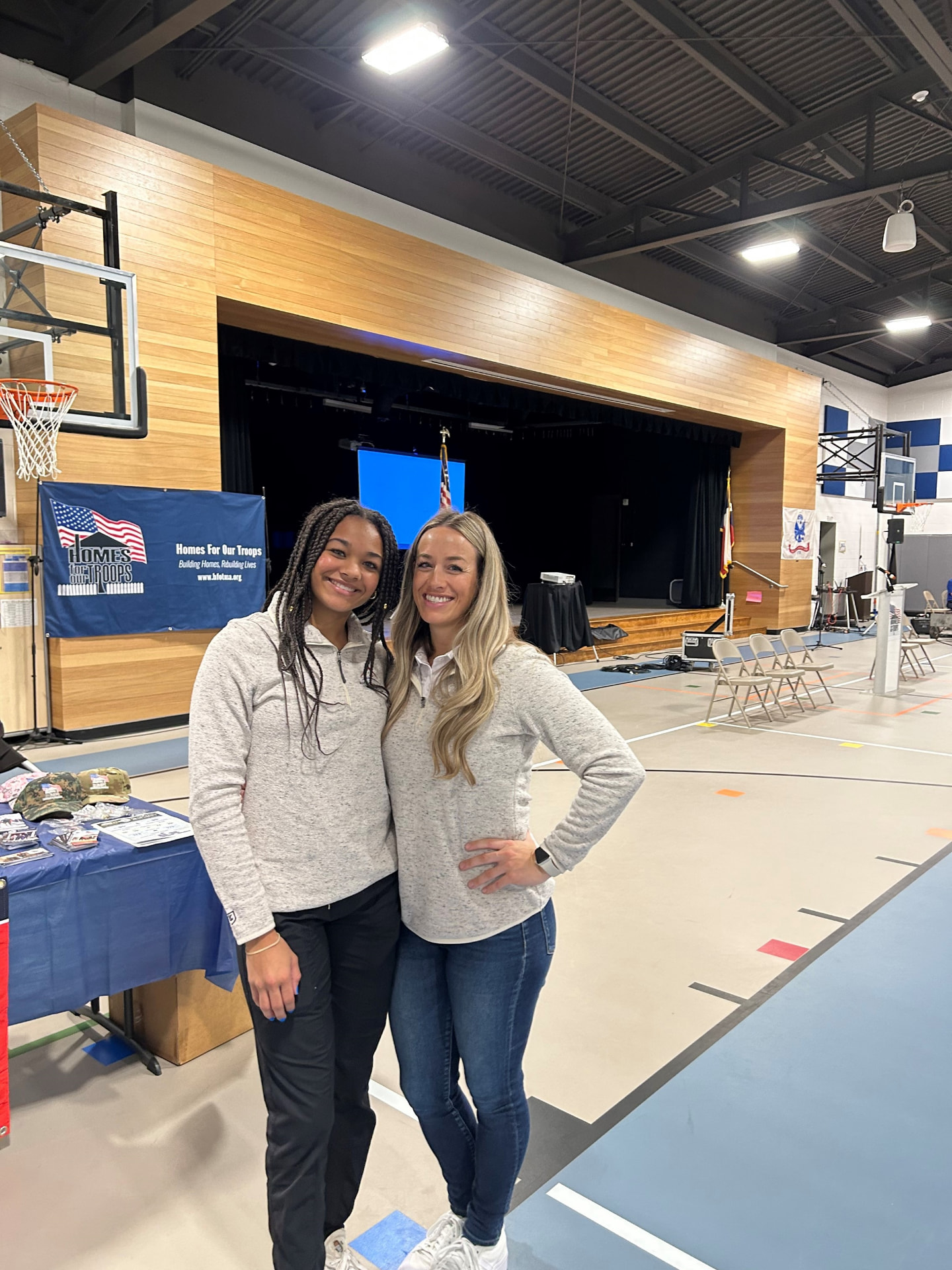 Acquisitions Manager Kelly Malone and her daughter volunteering at the Homes For Our Troops Community Kickoff event to build a custom home for an injured Army Sergeant in Liberty Hill, TX.