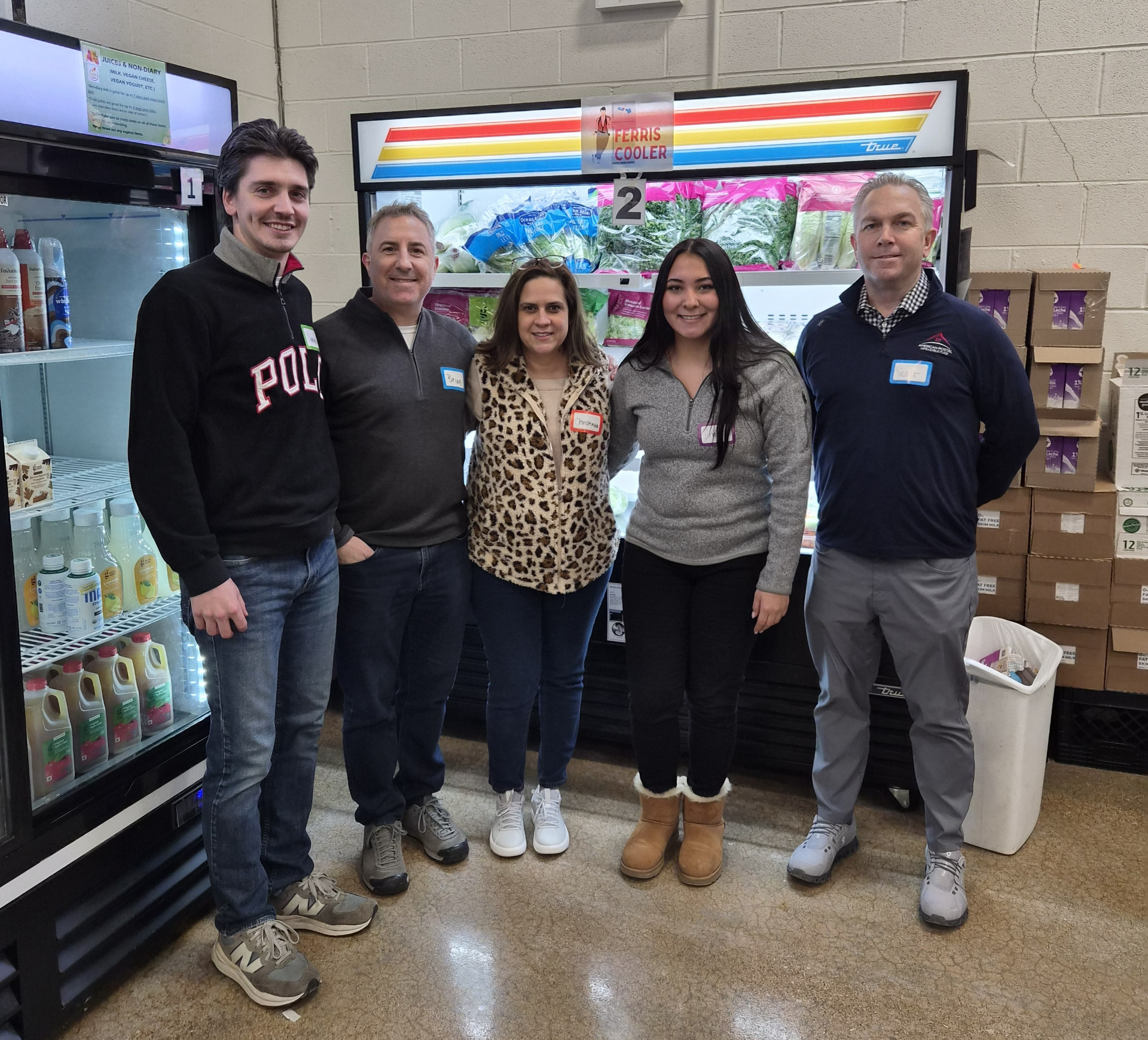 Oak Brook, IL API team members helping a local food pantry distribute food to the community.